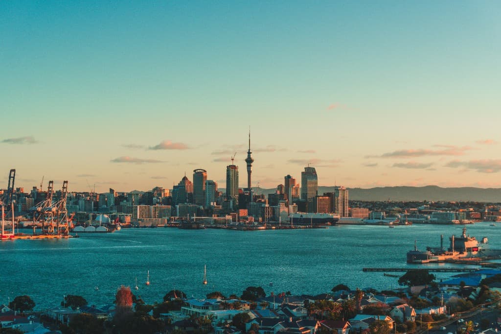 The Auckland city skyline and harbour at sunset